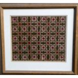 A late Victorian embroidered panel - of geometric design, framed and glazed, 44 x 48cm.