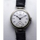 An early 20th century Omega wristwatch - the white enamel dial set out in Arabic numerals with a