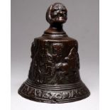 After the antique, a 19th century cast bronze bell - with grotesque mask, height 10cm.