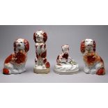 A 19th century Staffordshire figure of a begging spaniel - height 12cm, together with three other