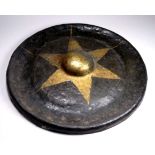 A hammered bronze gong - with gilt painted star decoration, diameter 33cm.