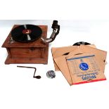 An HMV hardwood cased gramophone - with brass horn and a selection of 78rpm records.