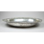 An early 20th century continental white metal dish - stamped 800, of oval form with a shaped bead