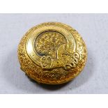 A Victorian gilt metal mourning brooch - circular engraved with foliage, diam. 2cm