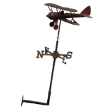 A 20th century weather vane in copper - modelled as a vintage bi-plane, the cardinal points in