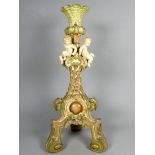 A Royal Worcester Rococo style candlestick - mounted with putto and blush decorated in pinks and