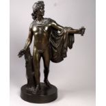 After the antique - a patinated spelter figure of the Belvedere Apollo raised on a circular base,