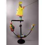 A 20th century polychrome painted articulated sculpture - modelled as a fisherman with rod and