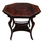 A late Victorian rosewood centre table - octagonal with stringing above four cabriole legs joined by