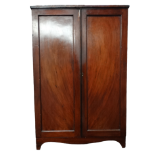 A Victorian mahogany cupboard - the rectangular top above a pair of panel doors enclosing shelves,