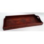An early 20th century hardwood and brass rectangular tray - decorated with trailing foliage, width