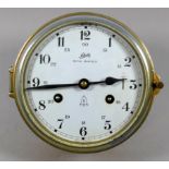 A brass 8 day bulkhead clock - Schatz, W. Germany, incorporating a striking mechanism, the white