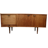 A vintage sapele sideboard - with a pair of doors enclosing drawers, flanked to one side with a fall