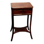 A 19th century continental mahogany kettle stand - the rectangular top with canted corners and brass