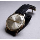 A 9ct yellow gold Universal Geneve gentlemans wristwatch - with silvered dial set out with baton