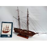 A model of a two masted vessel 'Le Hussard' - 1:50 scale, finished in natural wood, width 72cm,