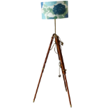 A contemporary standard lamp - with a beech and brass adjustable tripod base, height 164cm.