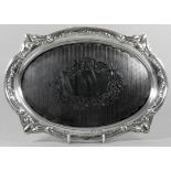 An oval silver waiter - Birmingham 1913, Charles Weale, with engine turning and engraved foliage,