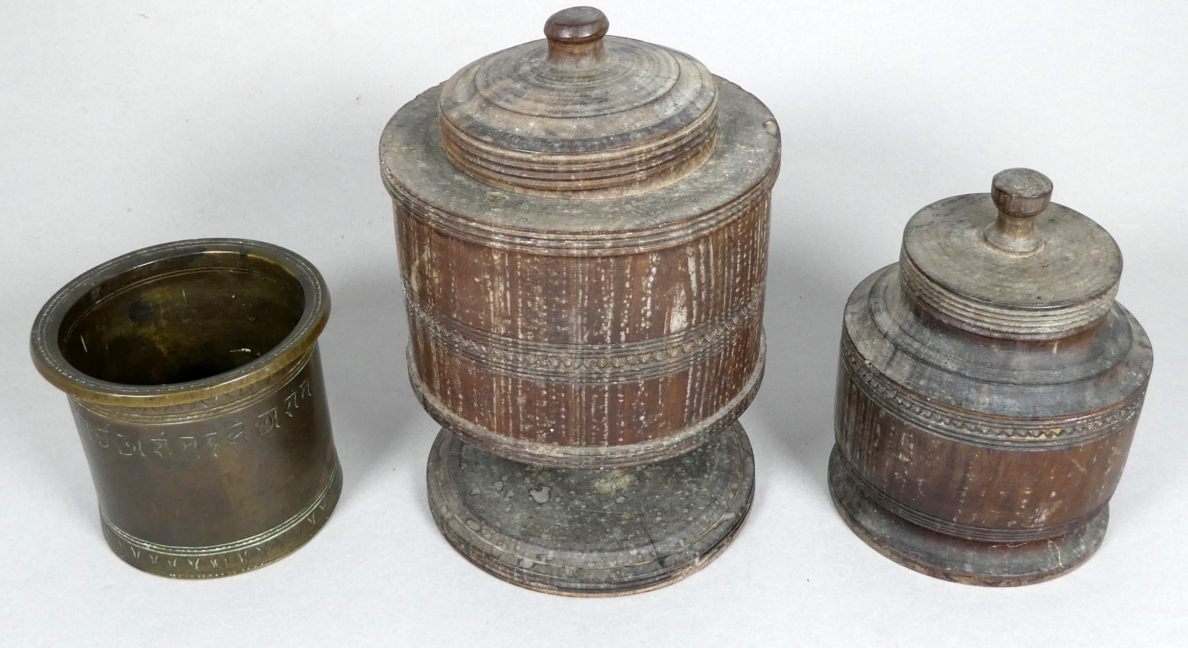 A 19th century bronze measure - engraved with palmettes, height 7cm, together with two treen jars - Image 2 of 6