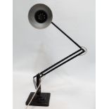 A Herbert Terry Anglepoise desk lamp - black finish on a stepped square base.