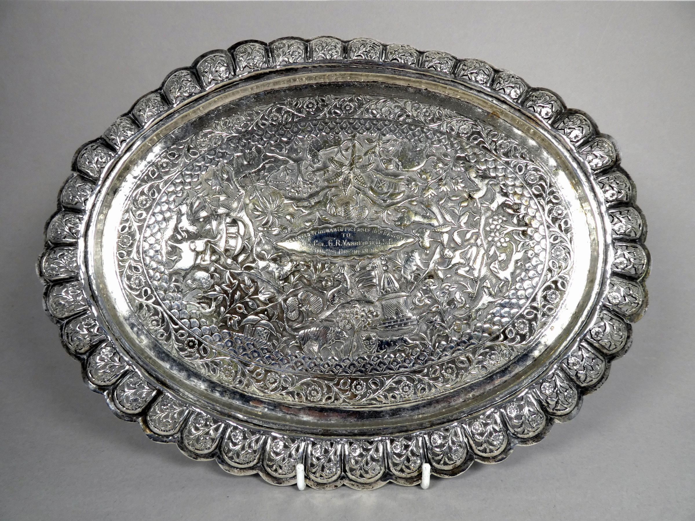 An Anglo Indian white metal tray - pierced with flowers and foliage, repousse decorated with