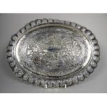 An Anglo Indian white metal tray - pierced with flowers and foliage, repousse decorated with