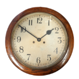 An oak cased wall clock - the white painted dial set out in Arabic numerals, fitted with a twin