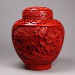 A Chinese cinnabar lacquer pot and cover - decorated with flowers, height 16cm.