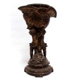 A late 19th century cast metal and gilt oil lamp base - in the form of cherubs supporting a
