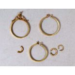 A pair of 9ct gold sovereign frames - together with a half sovereign frame, 4.6g (3)