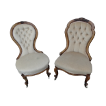 A Victorian walnut button upholstered low seat chair - with carved top rail and raised on carved