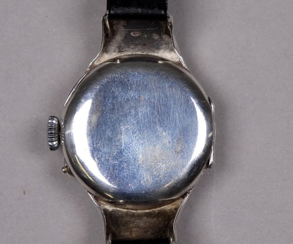 An early 20th century silver cased wristwatch - import mark for London 1913, the silvered dial set - Image 2 of 3