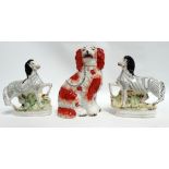 A Staffordshire flatback figure of a dog - height 26cm, together with a pair of zebra, height 21cm.