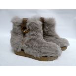 Ferragamo - a pair of ladies beige faux fur boots with leather and gilt detail, size 4/5.