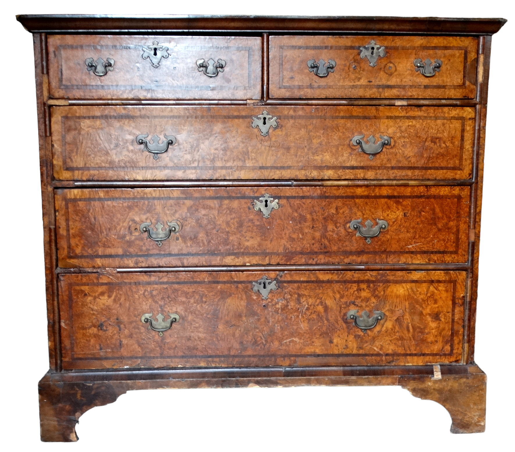 A George II walnut chest of drawers - the quartered veneered top above an arrangement of two short