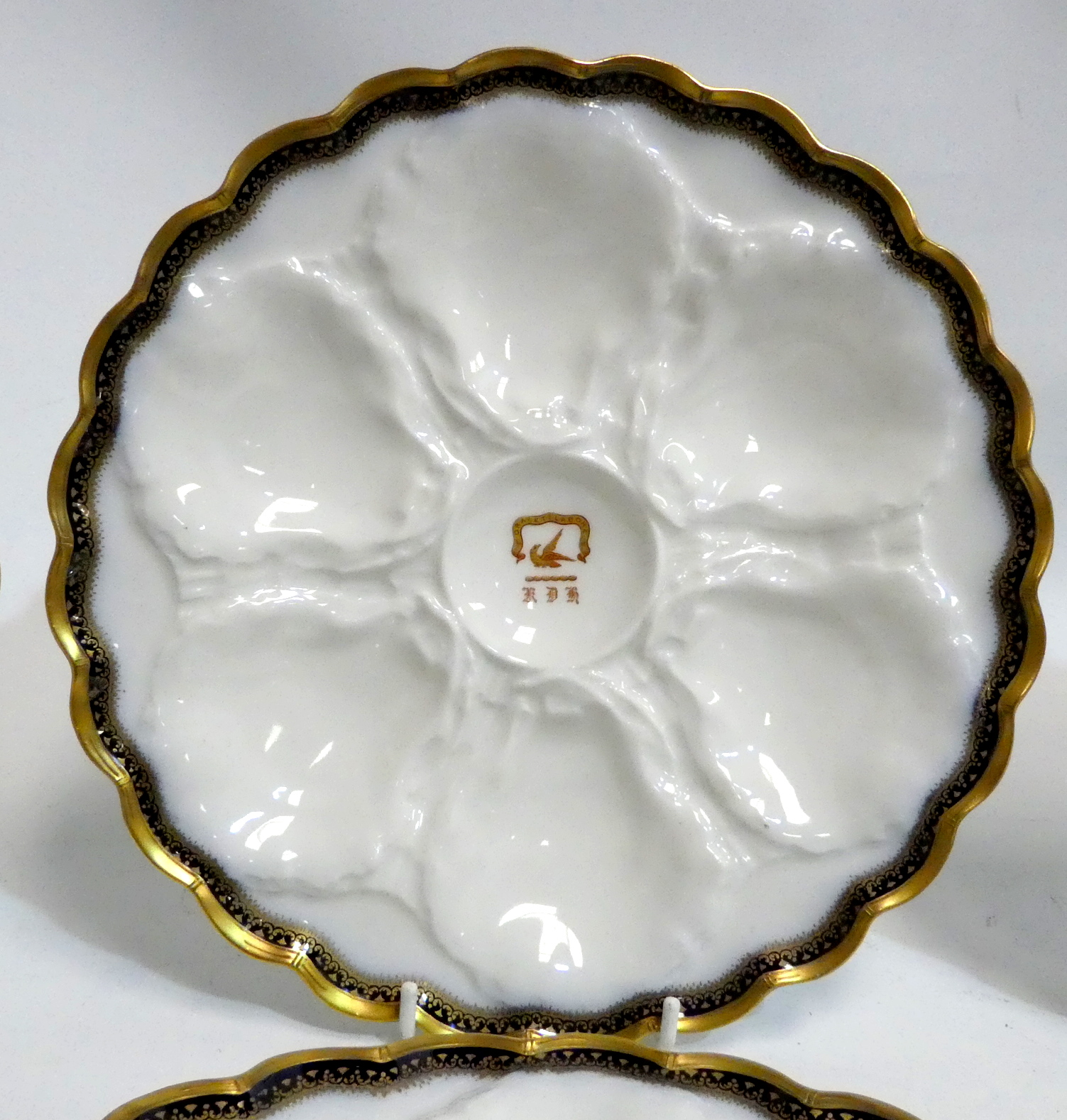 A set of six early 20th century French oyster plates - moulded with a gilt rim and ownership - Image 3 of 5