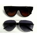 Two pairs of fashion sunglasses - to include Marc Jacobs and Stella McCartney.