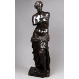 After the antique - a patinated spelter figure of the Venus de Milo, indistinct mark to base, height