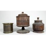A 19th century bronze measure - engraved with palmettes, height 7cm, together with two treen jars