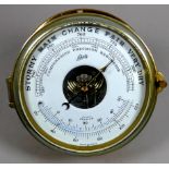 A brass bulkhead aneroid barometer - Schatz, W. Germany, the dial incorporating a thermometer,