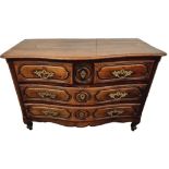 A late 18th century continental walnut chest of drawers - possibly French, the serpentine top