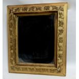 A 19th century gilt frame - moulded with foliate decoration and fitted with a later mirror plate,