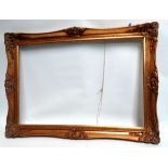 A gilt picture frame - aperture 75 x 50cm, overall size 89 x 64cm.