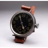 An early 20th century silver cased military style wristwatch - the black dial with luminous Arabic