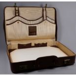 A tan pigskin writing case - the watered silk interior fitted with dividers, perpetual calendar,