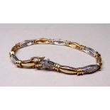 A 9ct yellow and white gold line bracelet - every other batten set with a cluster of diamonds,