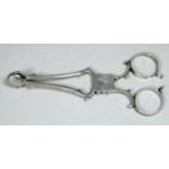 A pair of silver sugar nips - maker's mark for SC, length 10.5cm, weight 31g.