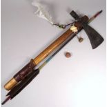 A native American tomahawk/peace pipe - the iron blade on a hickory shaft with shell and feather