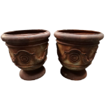 A pair of cast iron planters - urn shaped and cast with discs and swags, height 50cm (2).