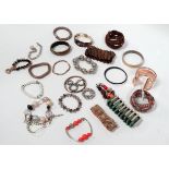 Approximately twenty-five costume jewellery bracelets.